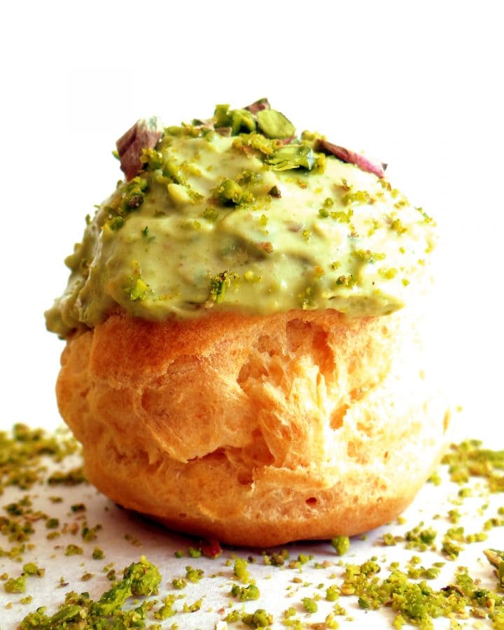 apricot and pistachio cream puffs on plate