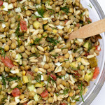 green lentil salad in mixing bowl
