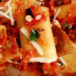 spoonful of pasta with ricotta and tomato sauce