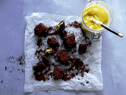 chocolate and orange truffles on baking parchment