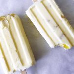 creamy lemon popsicles on baking parchment