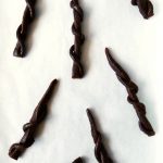 licorice wands on baking parchment
