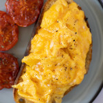 scrambled eggs on toast on plate