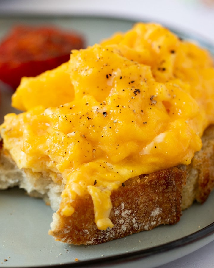 plate of scrambled eggs on toast