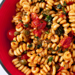 bowl of burst cherry tomato pasta
