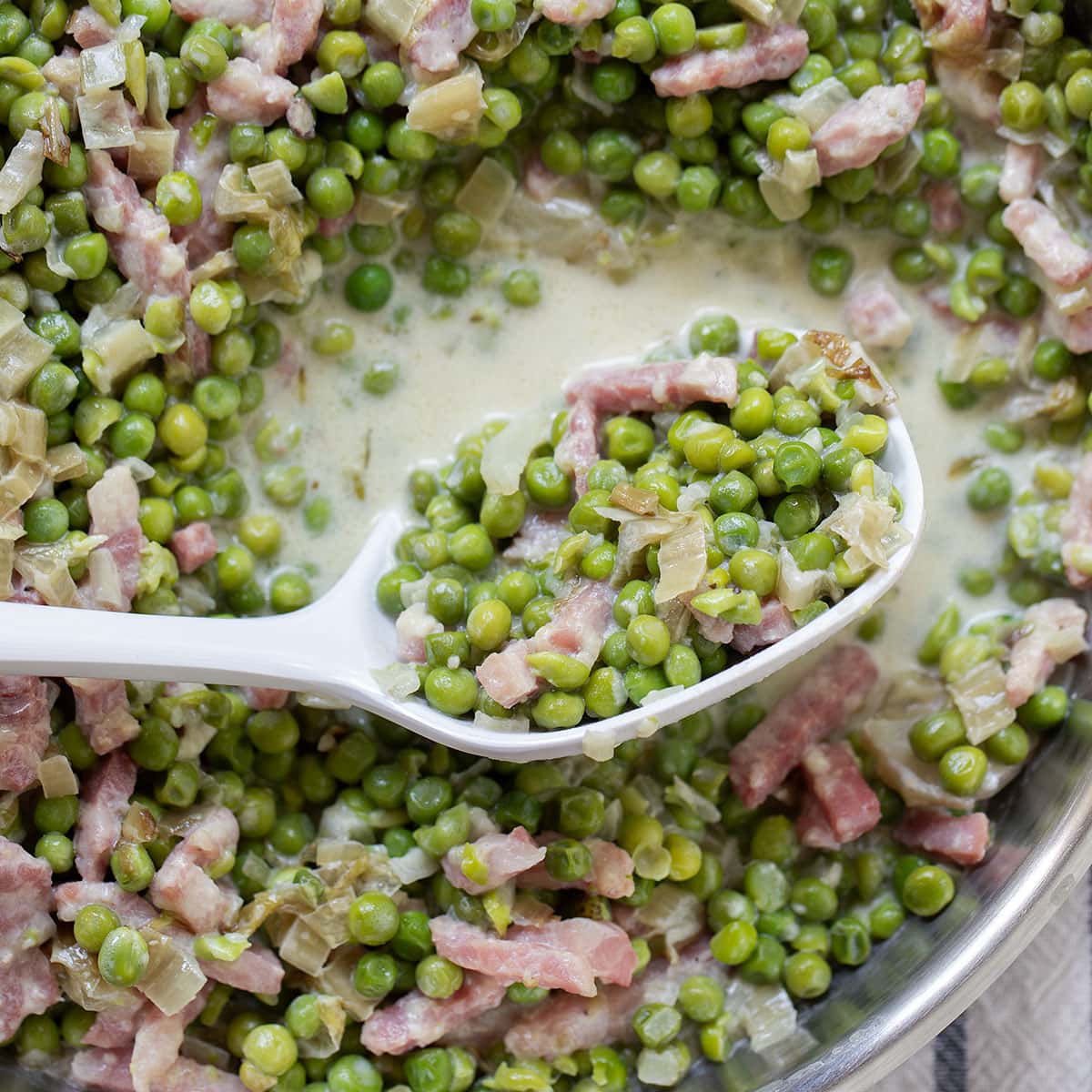french peas in a ladle