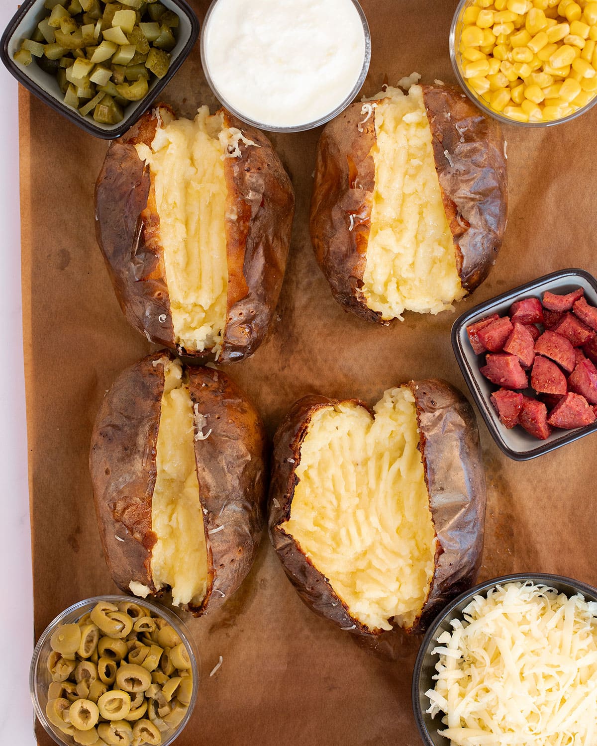 turkish baked potatoes with choice of toppings around