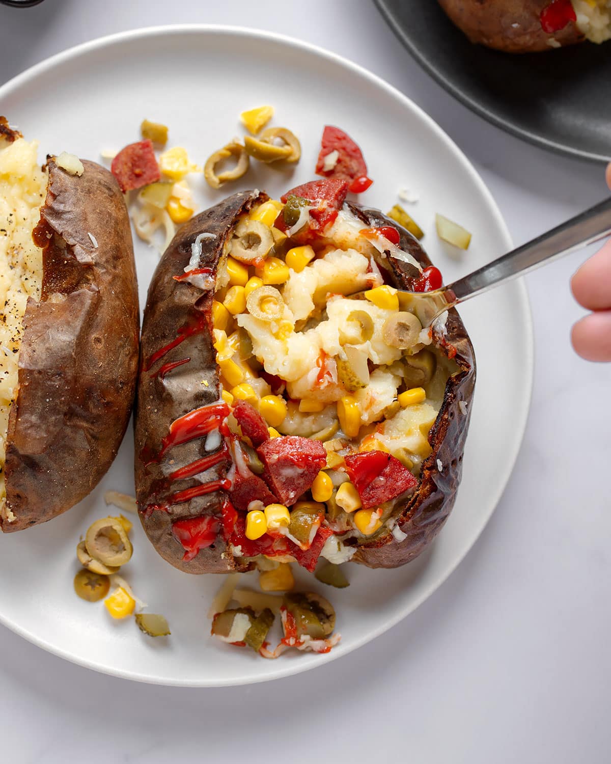 fork digging into a kumpir